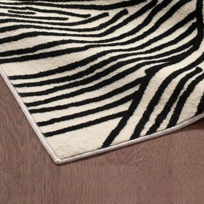 Brea Area Rug for modern, Nordic, Scandinavian, and minimalist home decor. Timeless black and cream colored area rug for living room, dining room, bedroom, office, or study available in various sizes.