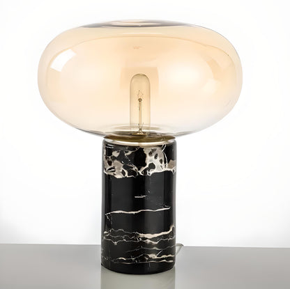 Cartie lamp, table lamp with marble base. Amber color glass with black color lamp base.