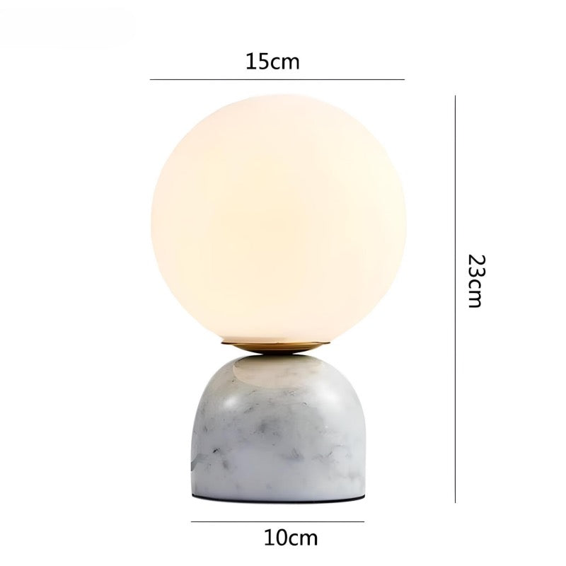 Quinn table lamp home decor. White color with round glass lamp shade measurements.