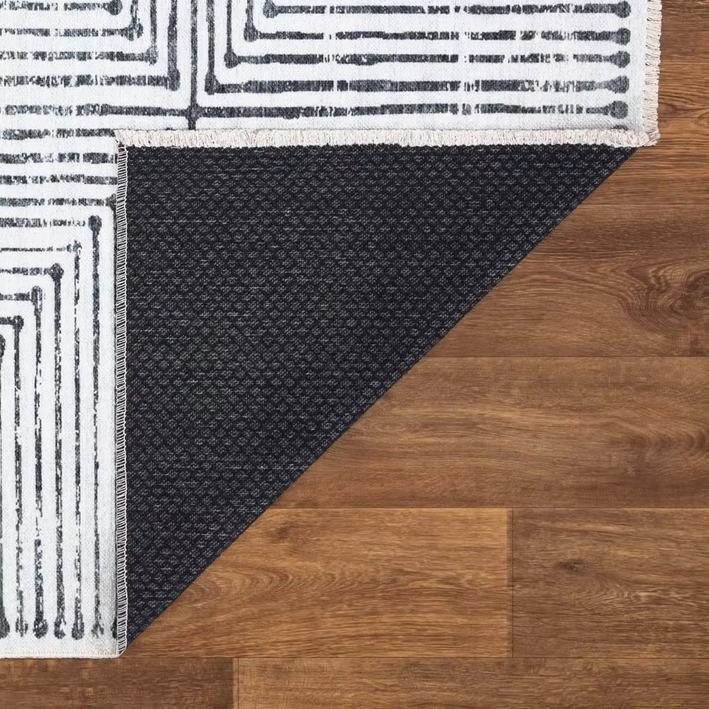 Valencia area rug for modern living rooms, bedrooms, dining rooms, office, or study. Classic minimalist black stripes and white background color.