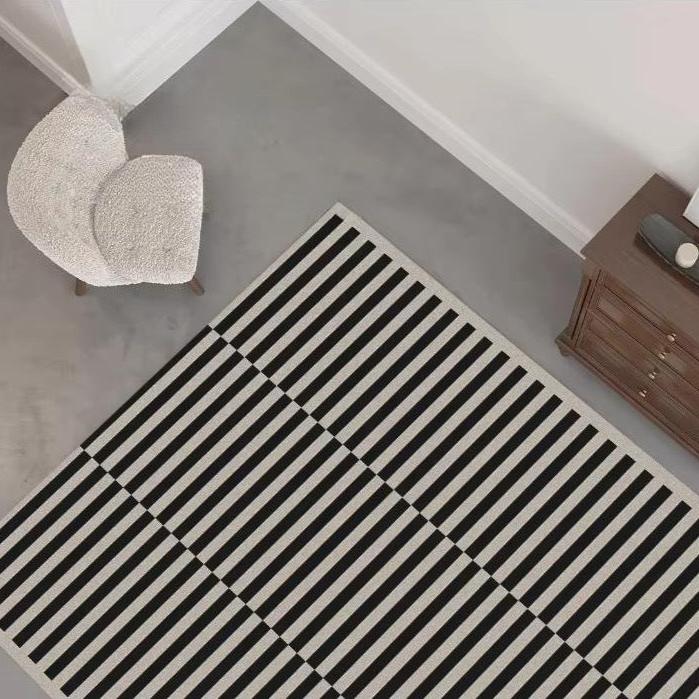 Vida Area Rug. Modern minimalist design area rug with classic black and cream lines. Area rug for living room, dining room, bedroom, study, or office home decor.